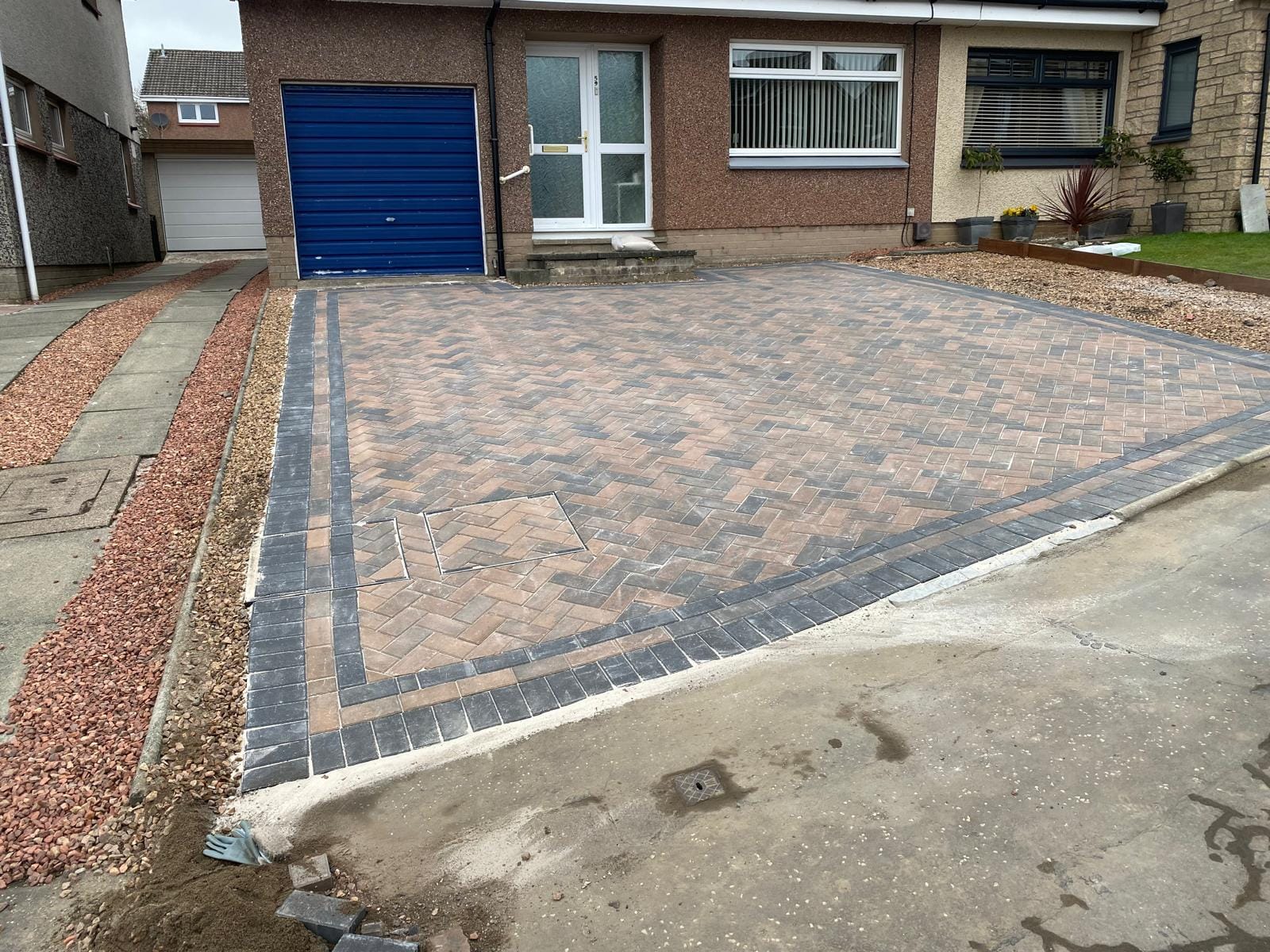 Rustic block paving driveway with garage
